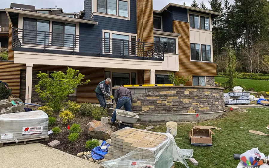 Rebuilt block retaining wall with new drainage behind it on a Bellevue slope
