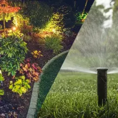 Pop-up sprinkler head watering a lawn, shown beside a landscape bed lit at night